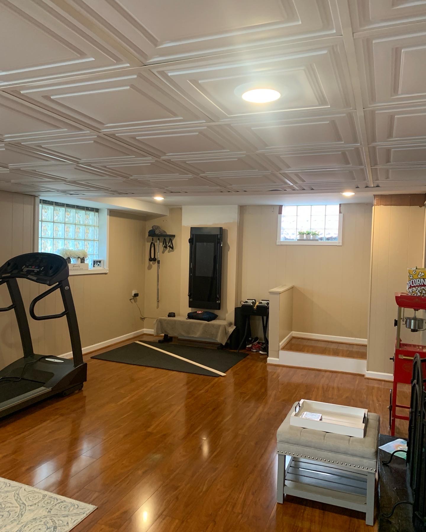 Renovated drop-down ceiling with new tiles.